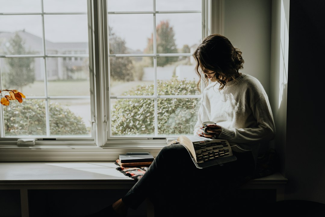 Woman sitting at home in a quiet reflective moment