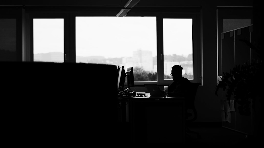 Professional working alone at a desk in an office